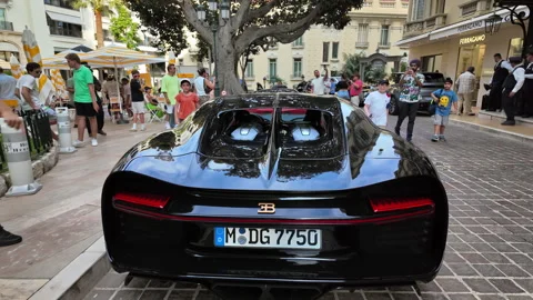Monte Carlo, Monaco - October 4, 2024: Black Bugatti car parked on the street Stock Footage 291900627