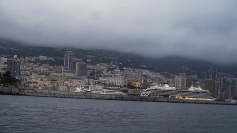 Monte Carlo Monaco viewed from a moving boat evening city coast French Riviera Stock Footage 95629671
