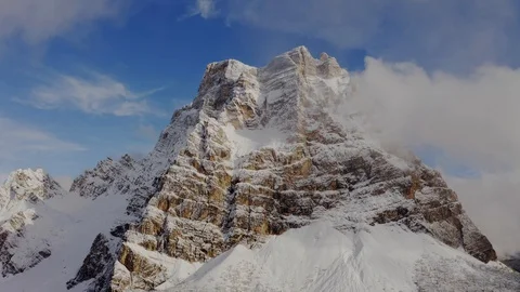 Monte Pelmo after a snowfall, at the end clouds are covering the whole view Stock Footage 129560063