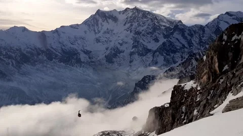 Monte Rosa, Alps - Passo Moro  - A cable car crosses the clouds Video stock 297203862