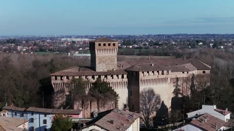 Montechiarugolo castle medieval architecture standing among trees. aerial Stock Footage 336775619