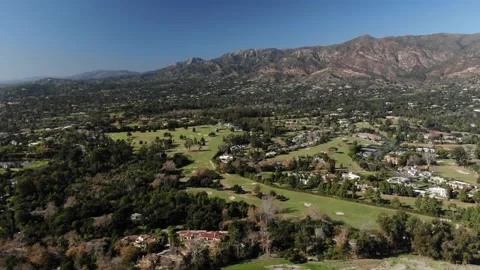 Montecito golf course and luxury homes wide daytime aerial Stock Footage 211190599