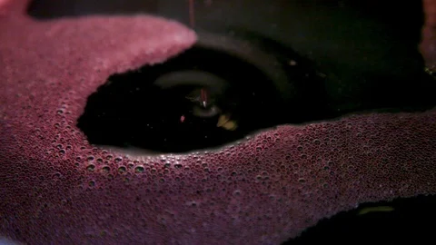 Montepulciano, the process of making red wine, drop in a barrel Stock Footage 99104456