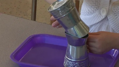 Montessori child transferring bean exercise In Montessori School Class  Stock Footage 83465711