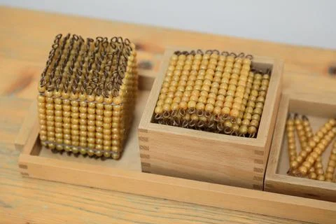 Montessori math bead cube and square for teaching volume and squares Stock Photos