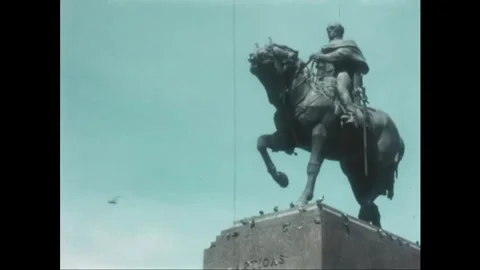 MONTEVIDEO - 1965 - Tourists reading maps at the Plaza Independencia. Statue and Stock Footage 340667980