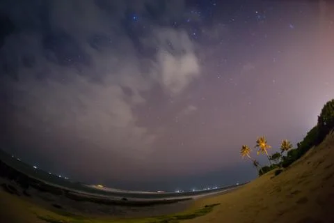 Month on a background star sky reflected in the sea Stock Photos