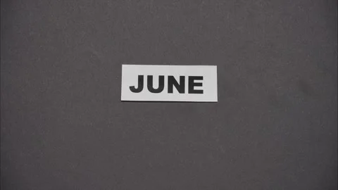 Month names changing on grey background. Stop motion Video stock 327611579