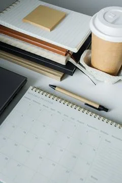 Monthly planner note pad opened on a new clean page on office table. Making.. Stock Photos