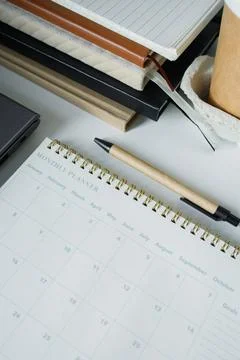 Monthly planner note pad opened on a new clean page on office table. Making.. Stock Photos