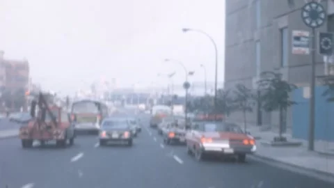 Montreal - 1967: driver's pov while driving downtown, vintage cars Stock Footage 257593663
