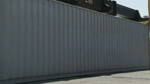 Montreal, Canada – 05/18/2012: Gray container, handler lift onto truck Stock Footage 188200488