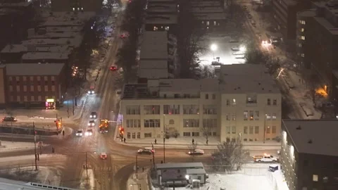 Montréal, Canada Dec '25 - High drone view of vehicles and plows moving in city Stock Footage 324866648