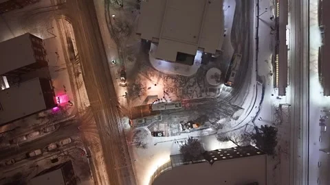 Montréal, Canada Dec '25 - Overhead drone tracking plows and vehicles snowy Stock Footage 324866741