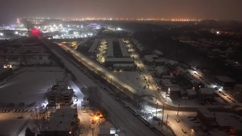 Montréal, Canada Dec '25 - Snow-covered industries and residential areas at Stock Footage 324869387