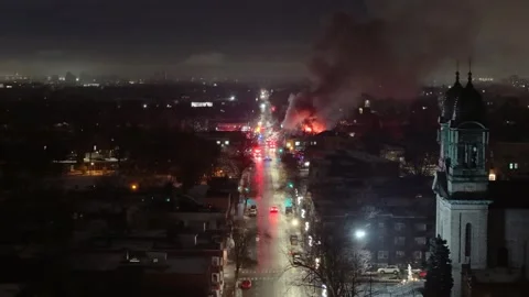 Montréal, Canada Dec 3 '25 - drone flying towards fire near church 動画素材 325537415