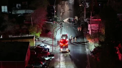 Montréal, Canada Dec 3 '25 - Bright Rescue Vehicles Illuminate Afterdark Roads Video stock 325539784