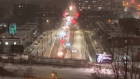 Montréal, Canada Dec 9 '25 - Distant city streets crossed by paired graders in Stock Footage 324867526