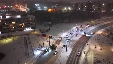 Montréal, Canada Dec 9 '25 - Snow graders moving in echelon across frozen lanes Stock Footage 324867946