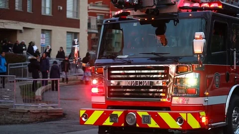 MONTREAL, CANADA: Firefighters &amp; Fire Trucks Outside During Morning Stock Footage 83527770