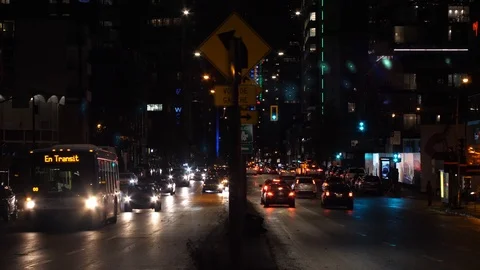 Montreal, Quebec downtown traffic, Boul. Rene Levesque at night Stock Footage