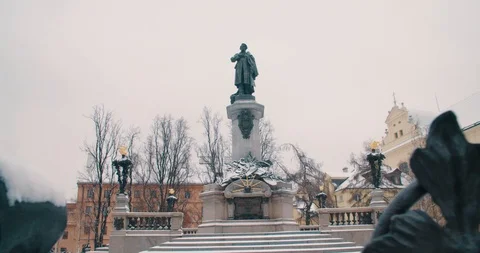 The monument of Adam Mickiewicz [Pull Back Through Fence] - Warsaw, Poland (4K) Video stock 101295332