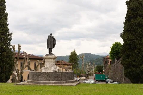 Monument from the back on the central square of Barga Stock Photos