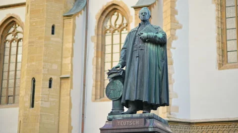 Monument of Bishop Georg Daniel Teutsch with Sibiu Lutheran Cathedral on the Stock Footage 229744731