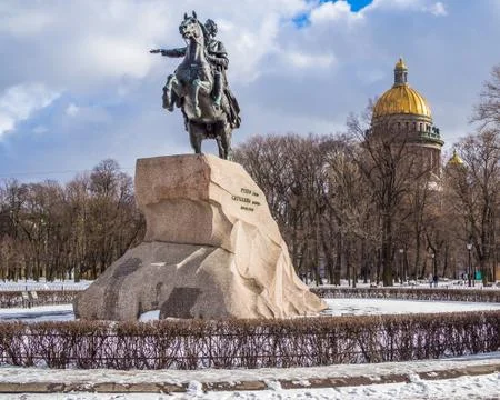 Monument dedicated to Peter the first with Isaac cathedral at the background Stock Photos