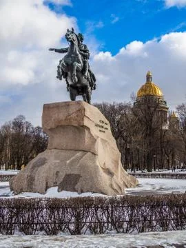 Monument dedicated to Peter the first with Isaac cathedral at the background Stock Photos