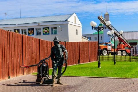 Monument to firefighter in front of the local fire station in Vladimir, Russia Stock Photos