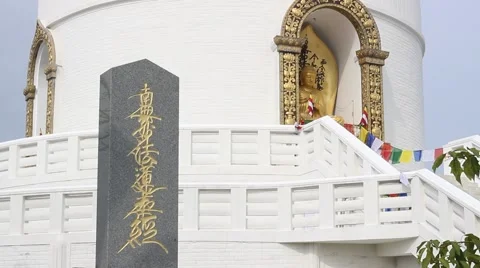 The monument to the founder on the background of Stupa Stock Footage 57854678
