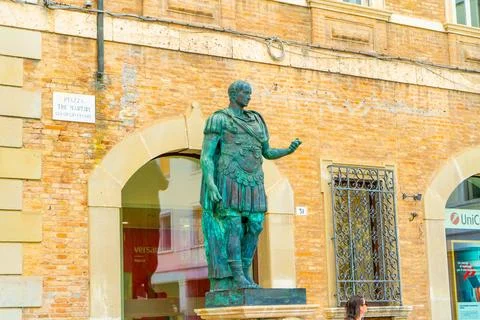 Monument to Gaius Julius Caesar in Piazza Tre Martiri in Rimini, Italy, whe.. Stock Photos