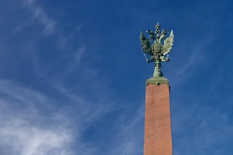 Monument iron double-headed eagle with scepter and orb in crown symbol of Rus Stock Photos