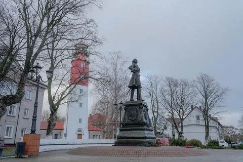 Monument to Peter the Great, in the background a red lighthouse, spring day w Stock-Fotos