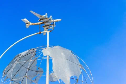 Monument. the plane is flying over the globe Stock Photos