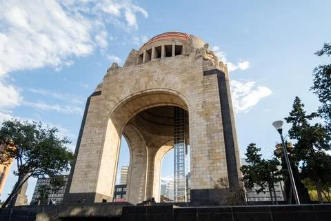 Monument to the Revolution under a slightly cloudy blue sky Stock Photos
