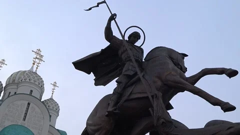 Monument to Saint George on the background of the russian church Stock Footage 150752394