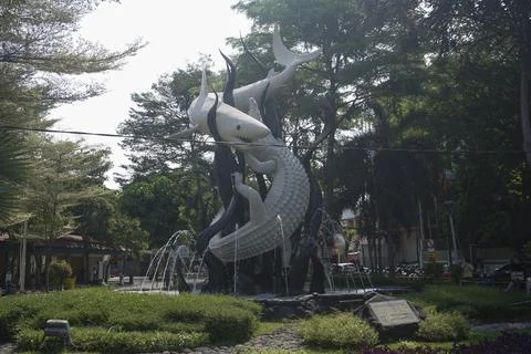 Monument statue of conflict between sharks and crocodiles Stock Photos