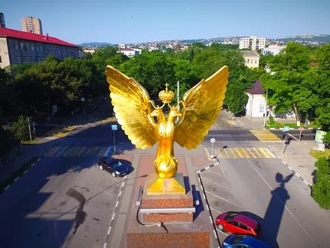 Monument two-headed eagle gilded. Stock Photos