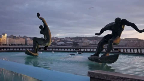 Monument to two surfers in the process of skating. Sunset Stock Footage 219766703