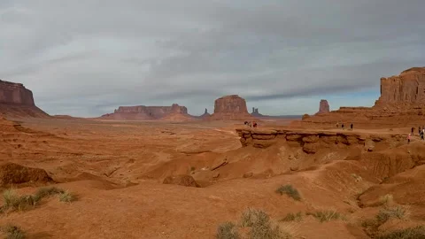 Monument Valley Pan Left The Valley Floor East Mittens and Merrick Butte- Stock Footage 309051386