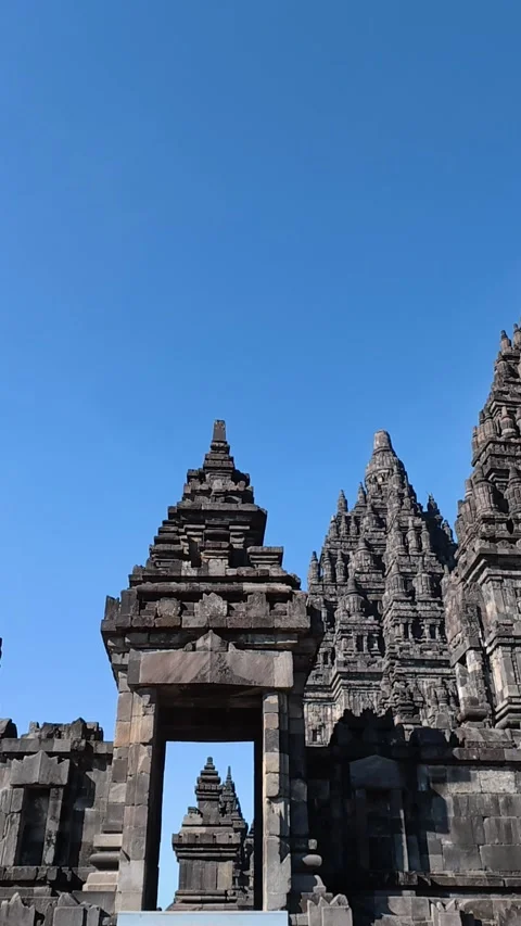 Monumental stone gateway frames the ornate towers and soaring spires of Pra.. Stock Footage 341543446
