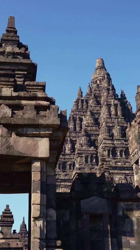 Monumental stone gateway frames the ornate towers and soaring spires of Pra.. Stock Footage 341548075
