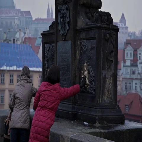 Monuments Prague. Touch the monument to happiness. Stock Footage 69423585