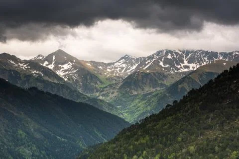 Moody and dramatic clouds over Pyrenees mountains Stock Photos