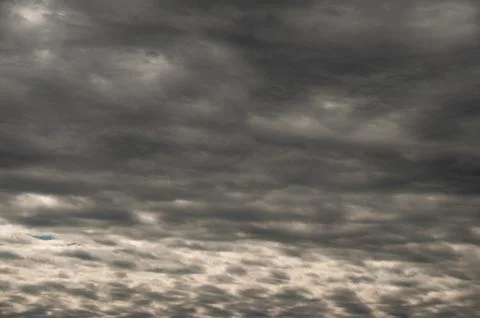 A moody and dramatic sky with dark and ominous storm clouds Stock Photos