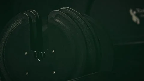 Moody Close-up of Taking an Adjustable Dumbbell from a Rack Video stock 329764253