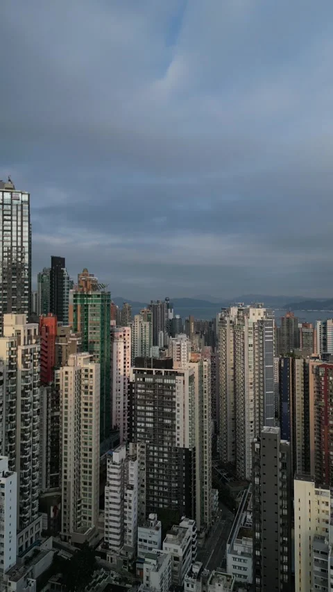 Moody Clouds Moving Over Dense Hong Kong Cityscape Stock Footage 335844749