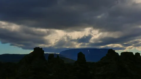 Moody clouds moving over Dimmuborgir lava fields in Iceland Stock Footage 330283174